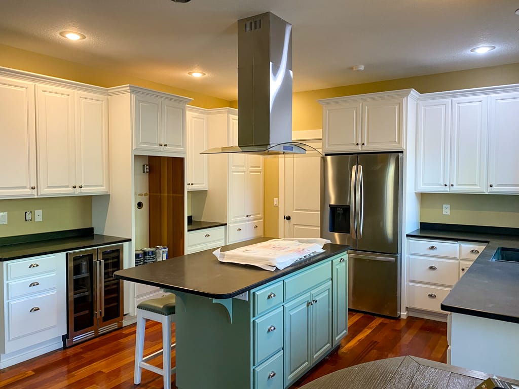 kitchen cabinets professionally painted in white and green