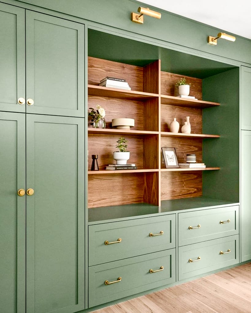 kitchen cabinet painted in light green with added decoration