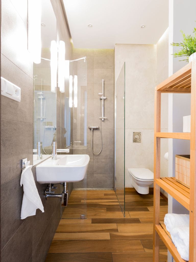 Modern bathroom with wood accents and glass shower