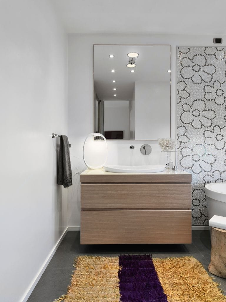 Modern bathroom with floral wall design